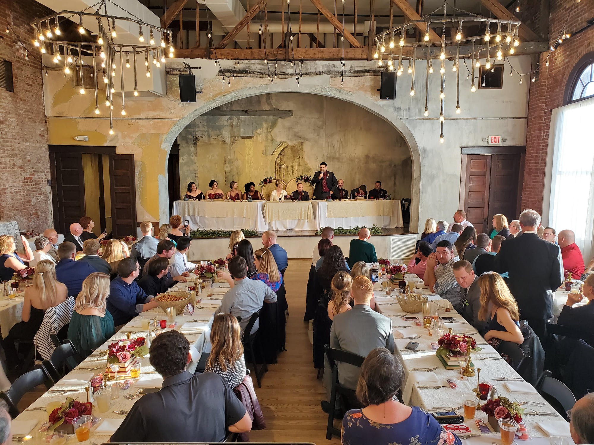 Toasts on stage of third floor of Neidhammer Wedding East Side