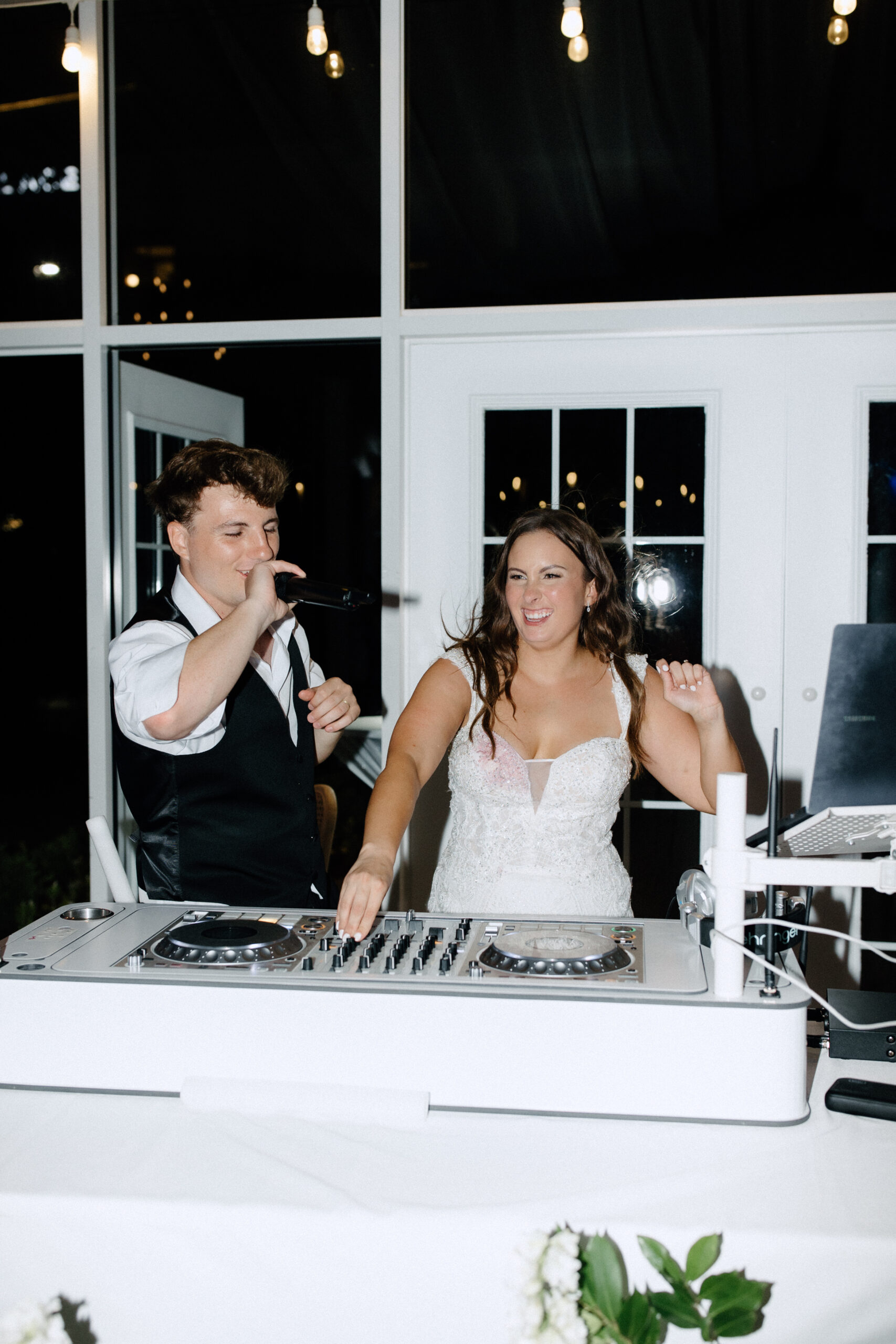 25WeddingHopf-1221-scaled Dawson and Sarah behind DJ Mikey's Turn Tables